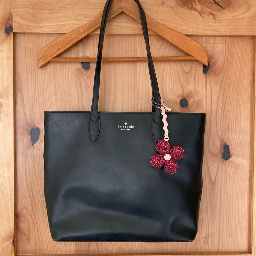 Black Kate Spade Medium Tote Bag with pink glitter flower charm